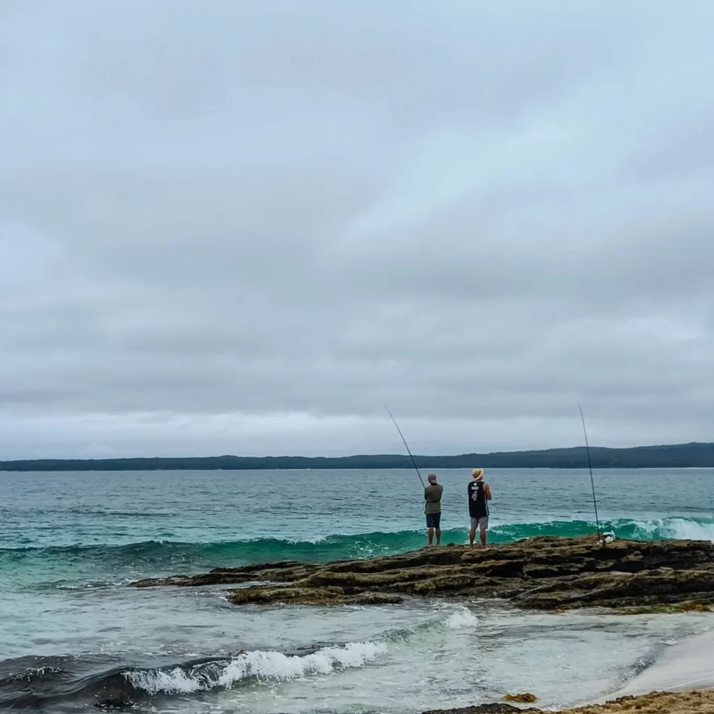 Two men fishing in the ocean